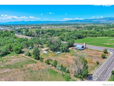 View South West to Boulder. Homestead, Barn and Silo. St. Vrain River on Southern Boundary. Within City Limits. Zoned Agricultural. | Image 1