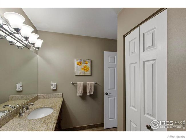 The linen closet in the shared primary bath on the upper level is a generous size and also has the 6 panel doors seen throughout the home. | Image 17