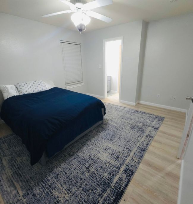 Bedroom 2 featuring light wood-style flooring and a ceiling fan | Image 18