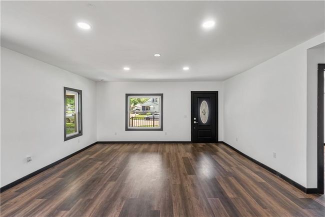Entrance foyer featuring baseboards, recessed lighting, and dark wood finished floors | Image 13