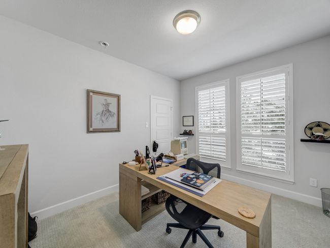 Home office with light carpet and baseboards | Image 17