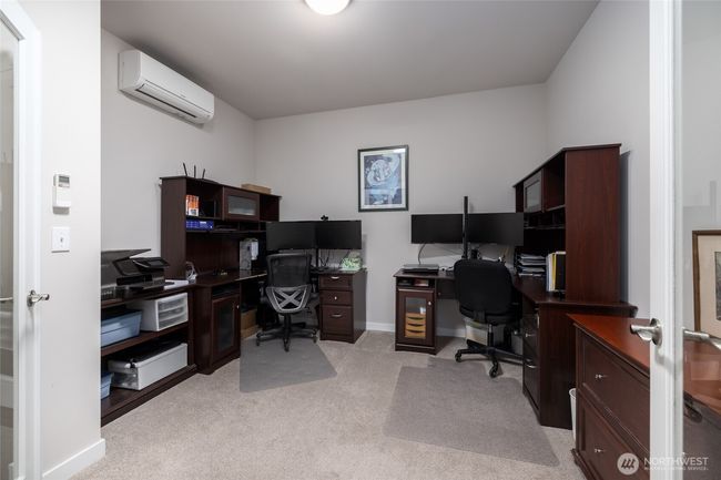 There is a den with double french doors and a solatube for natural light. | Image 8