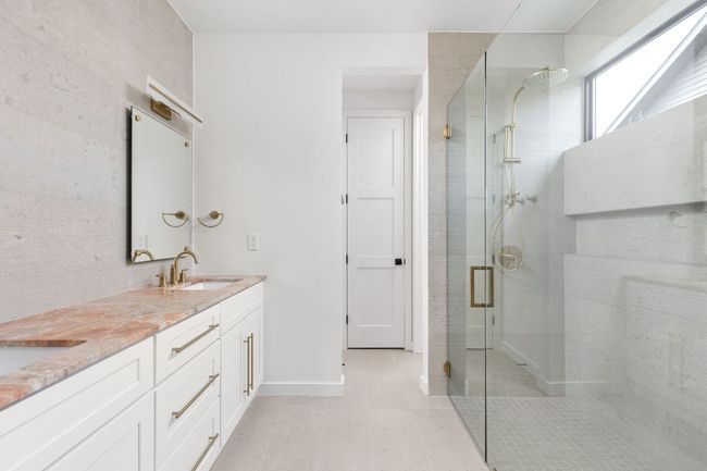 Full bathroom featuring a shower stall and double vanity | Image 25