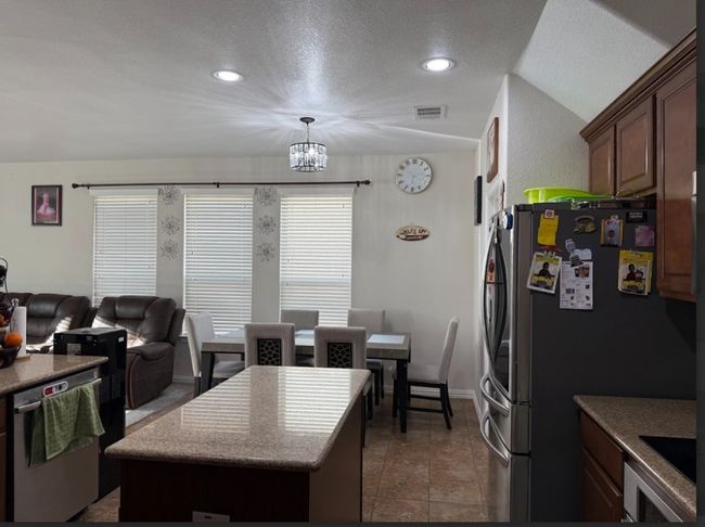 View of kitchen to dining area. | Image 19