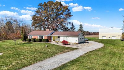 Home with over 4 acres, barn and pond. | Image 1