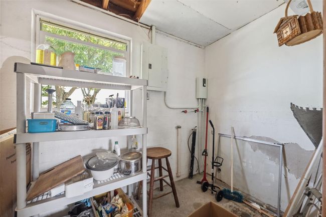 Storage Room with electric panel, plumbing for washer/dryer | Image 16
