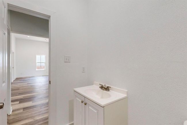 Bathroom with hardwood / wood-style floors and vanity | Image 25