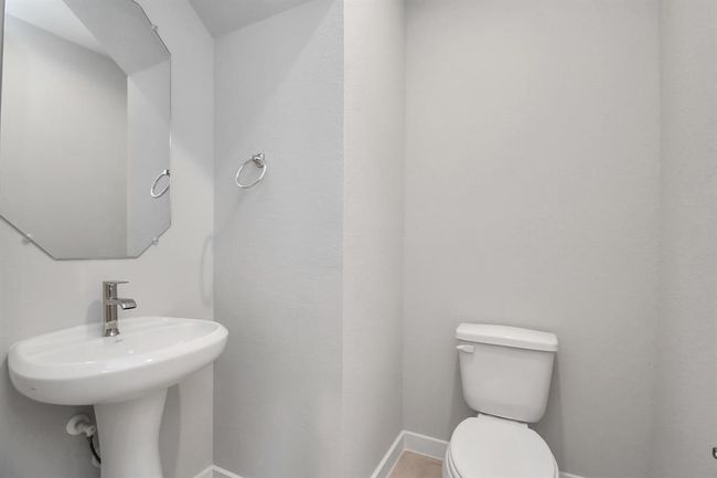 The half bathroom, conveniently situated on the 1st floor, is adorned with contemporary finishes. | Image 11