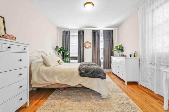 Bedroom featuring light wood-type flooring | Image 12