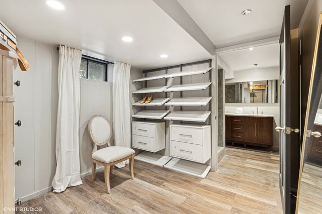 Primary suite walk-in closet and dressing room | Image 25
