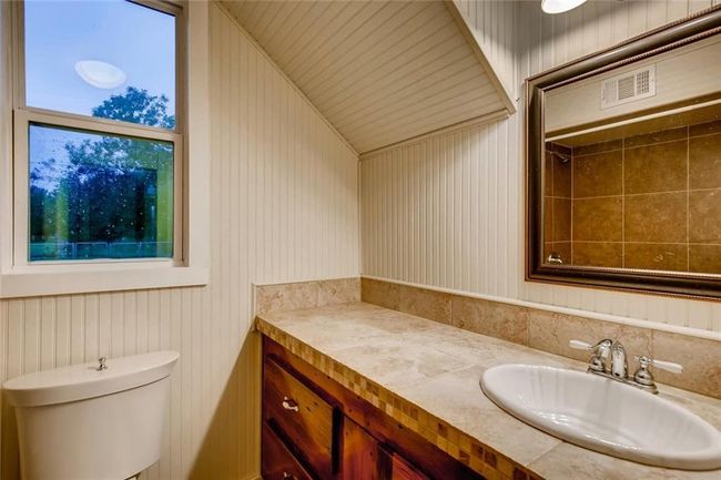 Bathroom featuring vanity and toilet | Image 17