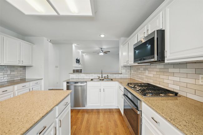 Stainless steel appliances and check out the gas stove. | Image 14