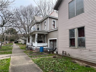 View of home's exterior with covered porch | Image 3