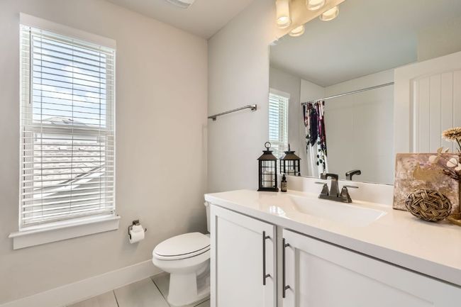 Bathroom featuring vanity, tile patterned floors, and curtained shower | Image 26