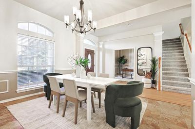 Dining space with ornate columns and light wood-type flooring | Image 3