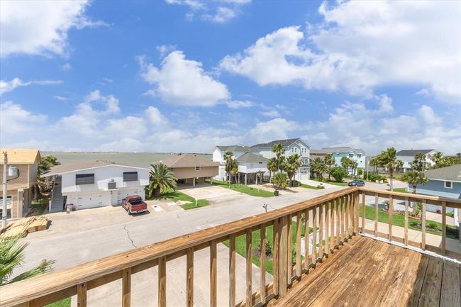 Enjoy a private deck off the primary bedroom on the top floor, offering serene views and relaxation. | Image 30