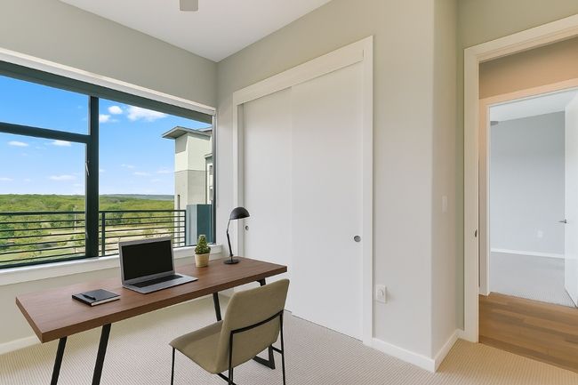 This secondary bedroom offers some beautiful sunset views to the southwest. | Image 14
