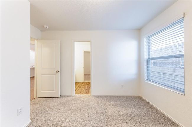 Unfurnished bedroom featuring carpet and baseboards | Image 12