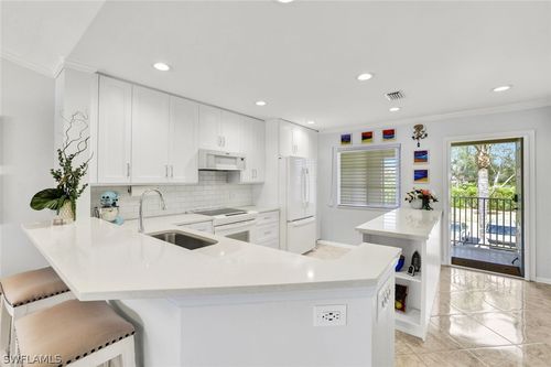 v203-7742 Emerald Circle, NAPLES, FL, 34109 | Card Image