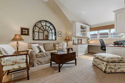 bedroom#3/office with custom built-ins, lots of storage and full bath down several stairs | Image 3