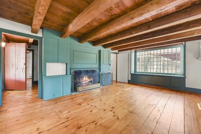 Fireplace, Beams, Plank Hardwood floors and box bay window | Image 3