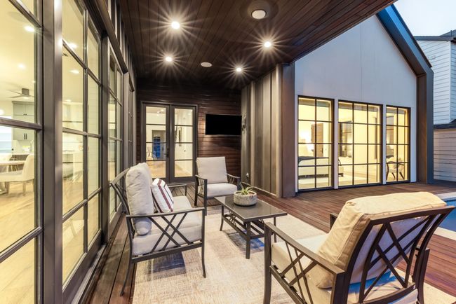 Sunroom / solarium featuring ceiling fan and an outdoor hangout area | Image 33
