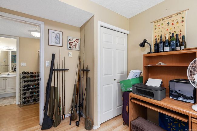 ABOVE GROUND LOWER LEVEL THIRD BEDROOM CURRENTLY USED FOR OFFICE AND MULTI-SPORTS STORAGE | Image 20