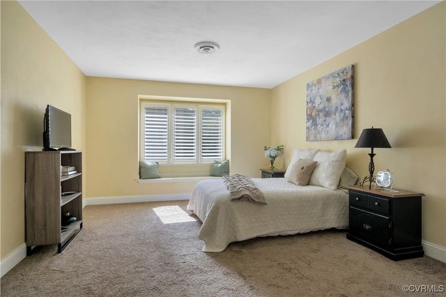 Bedroom with baseboards, visible vents, and carpet floors | Image 22