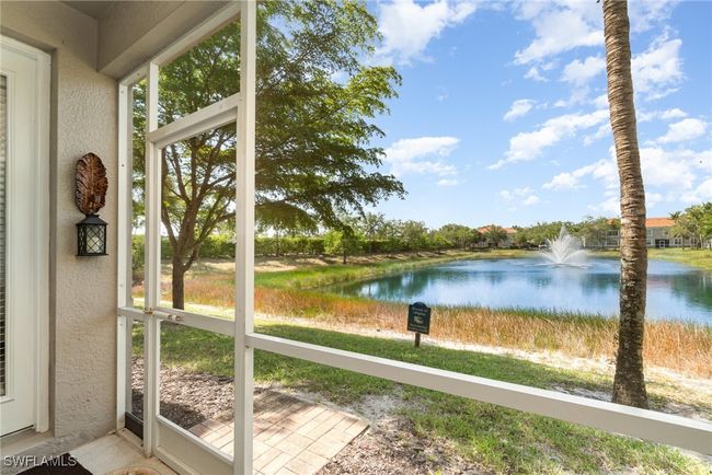 Unfurnished sunroom featuring a water view, a textured wall, and healthy amount of natural light | Image 16