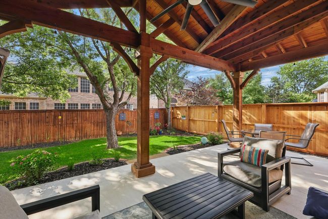 View of patio / terrace featuring a ceiling fan and outdoor dining space | Image 32