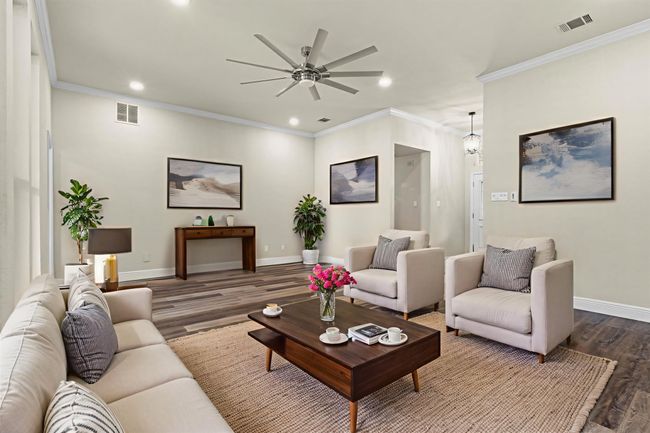 A view of the living room from the breakfast area. (This photo has been virtually staged to show it's potential.) | Image 8