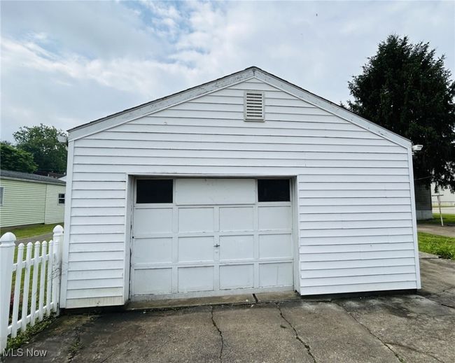 Detached garage featuring driveway | Image 18