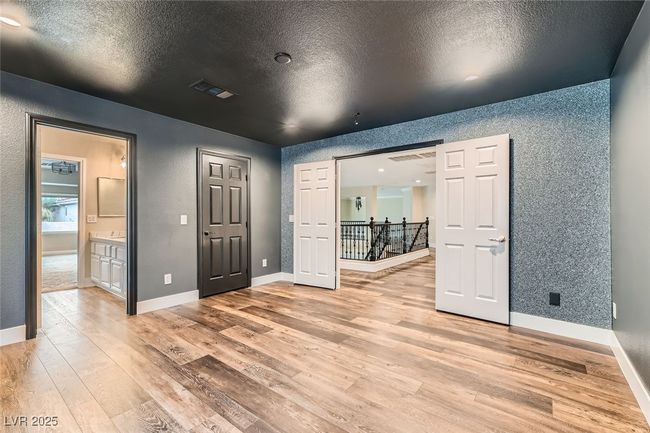Spare room with light wood-type flooring and a textured ceiling | Image 30