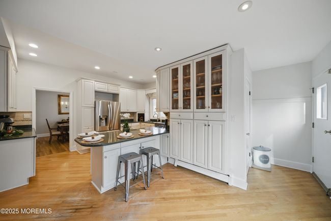Eat in Kitchen with separate Dining, Coffee bar, SS appliances with sliders to LARGE deck with privacy and nature. | Image 9
