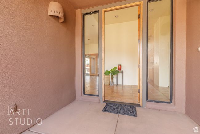 View of exterior entry with stucco siding | Image 10