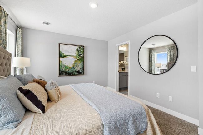 Owner's suite is large enough for a King bed and more. Photo is of Model home. Colors and options may vary. Ask Sales Agent for details. | Image 25