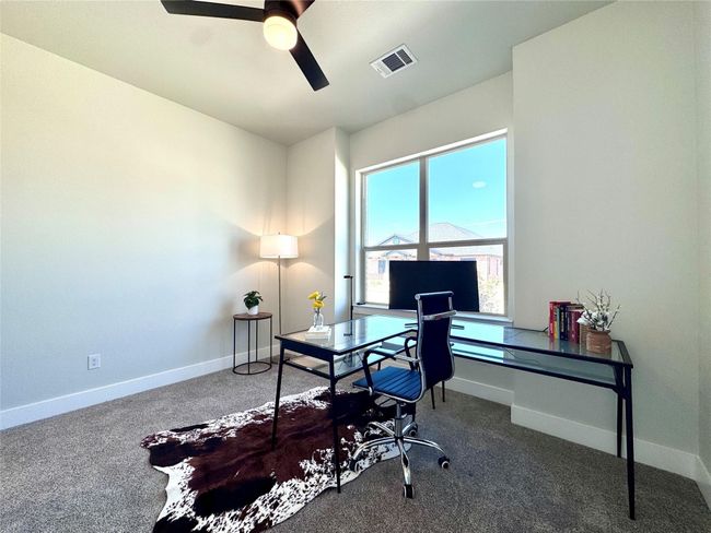 Office space featuring a ceiling fan and carpet floors | Image 5