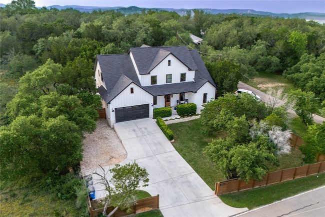 View from above showcasing the lush landscaping and serene surroundings. | Image 5