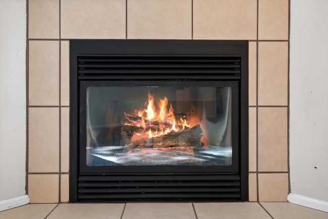 Detailed view of a glass covered fireplace | Image 10