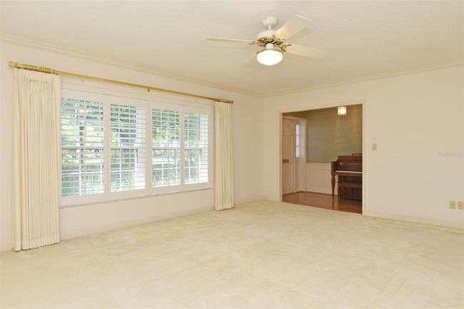 Living Room w/ views of Lake and Foyer | Image 24