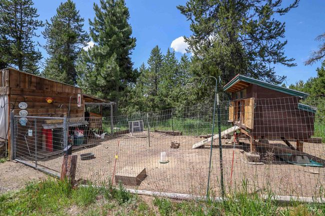 View of yard featuring exterior structure and an outdoor structure | Image 44