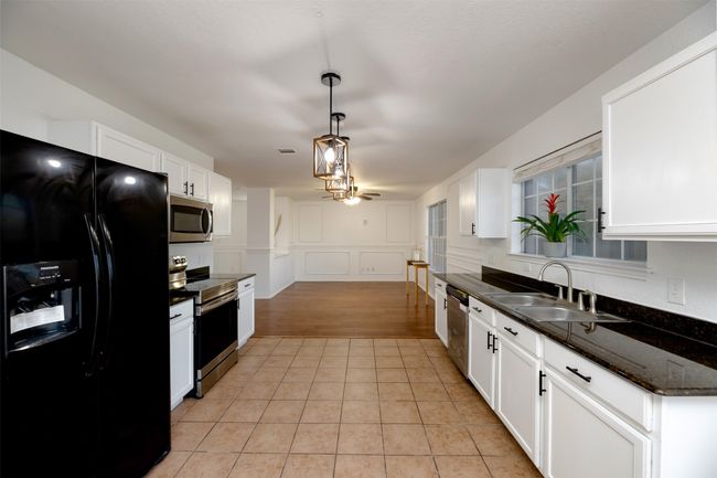 Clothes washing area with washer and clothes dryer, visible vents, laundry area, and light Washer/Dryer convey! | Image 14