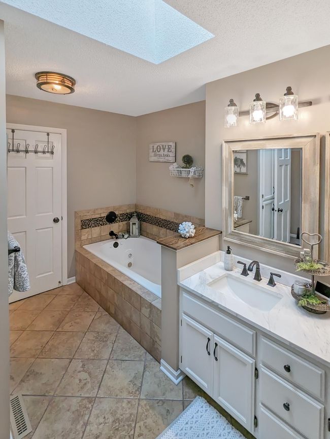 Custom tiled bath with separate tub and shower. | Image 4