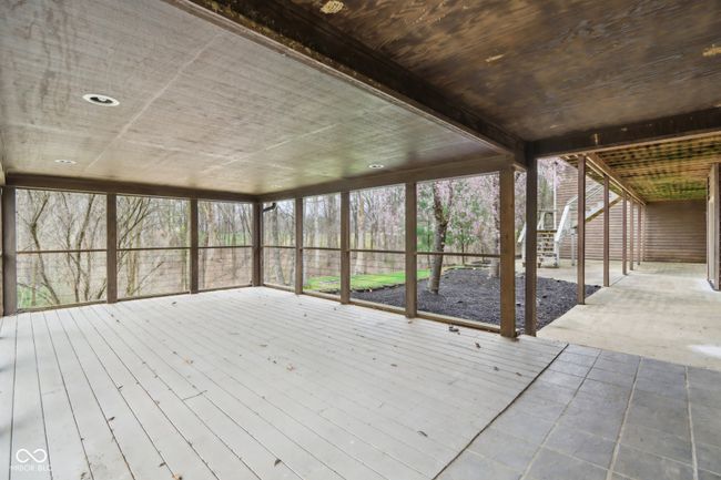 wooden terrace featuring stairs and a patio area | Image 49