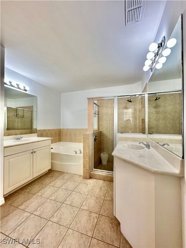 Bathroom featuring plus walk in shower, vanity, and tile patterned floors | Image 15