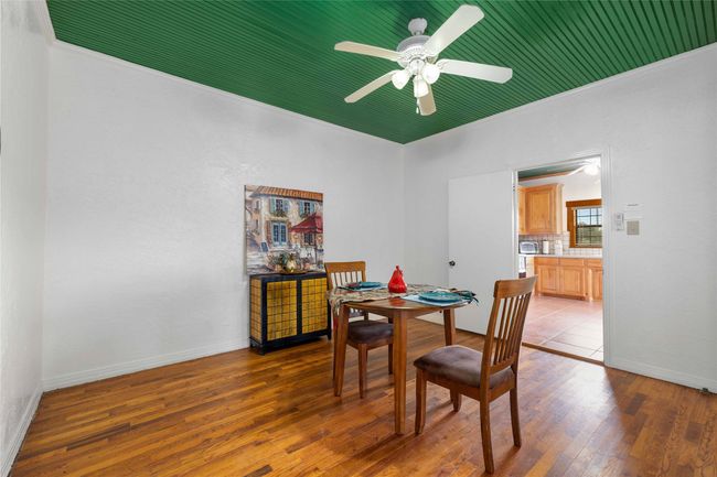 Dining area featuring wood finished floors, ceiling fan, and ornamental molding | Image 12