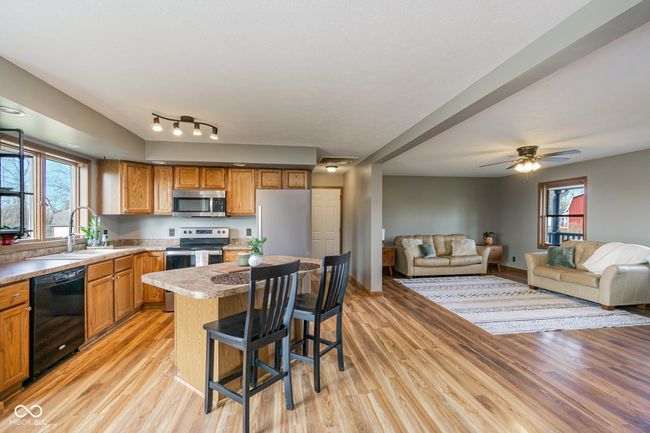 kitchen featuring a sink, a wealth of natural light, light wood-style floors, and appliances with stainless steel finishes | Image 4