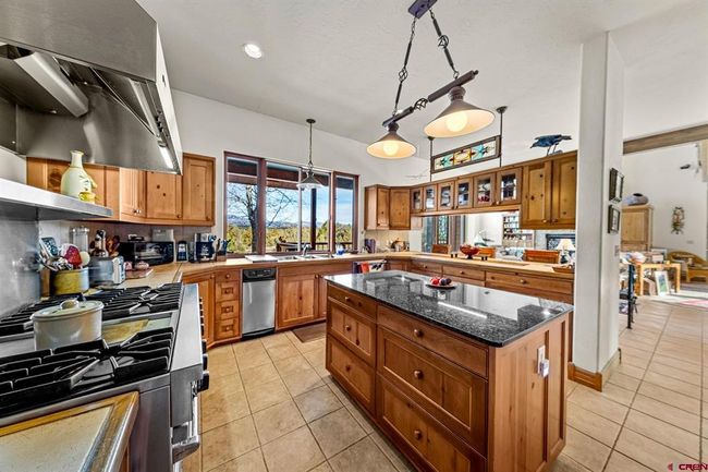 Pass-through windows over the sink connect with the back deck | Image 13
