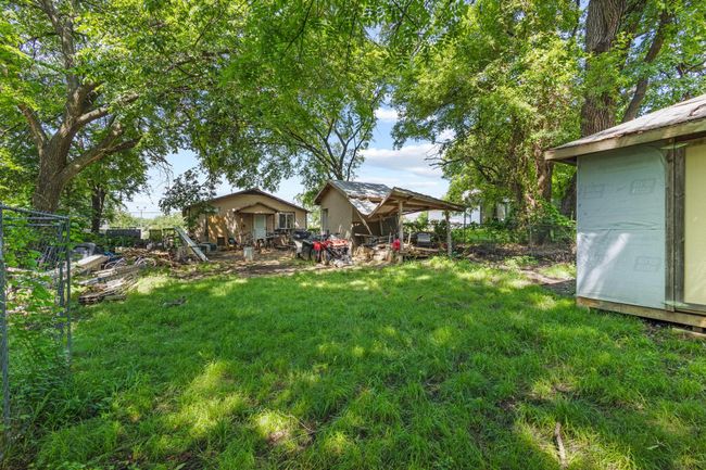 View of green lawn featuring an outbuilding | Image 24