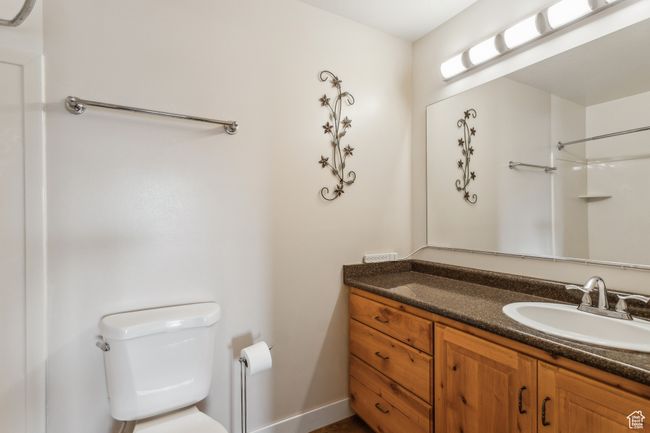 Full bathroom with toilet, vanity, and baseboards | Image 14